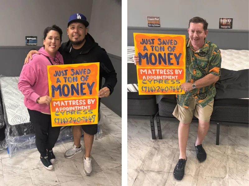 customers holding a sign that says 'I just saved a bunch of money at mattress by appointment henderson'