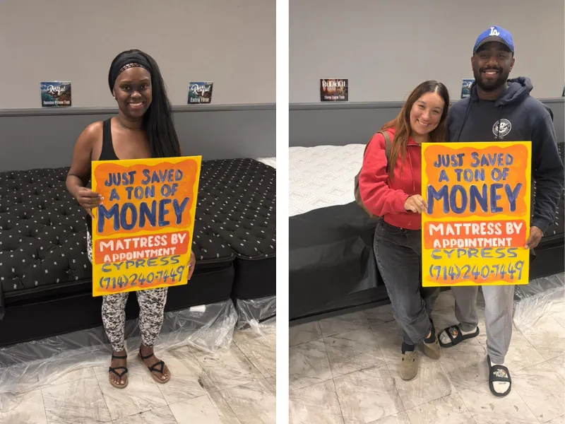 customers holding a sign that says 'I just saved a bunch of money at mattress by appointment henderson'