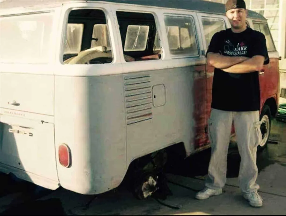 Ryan Siordia standing next to a VW Bus early in his career.