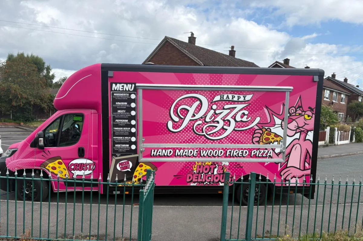 Mobile caterer in Manchester serving pizza from a wood fired pizza van
