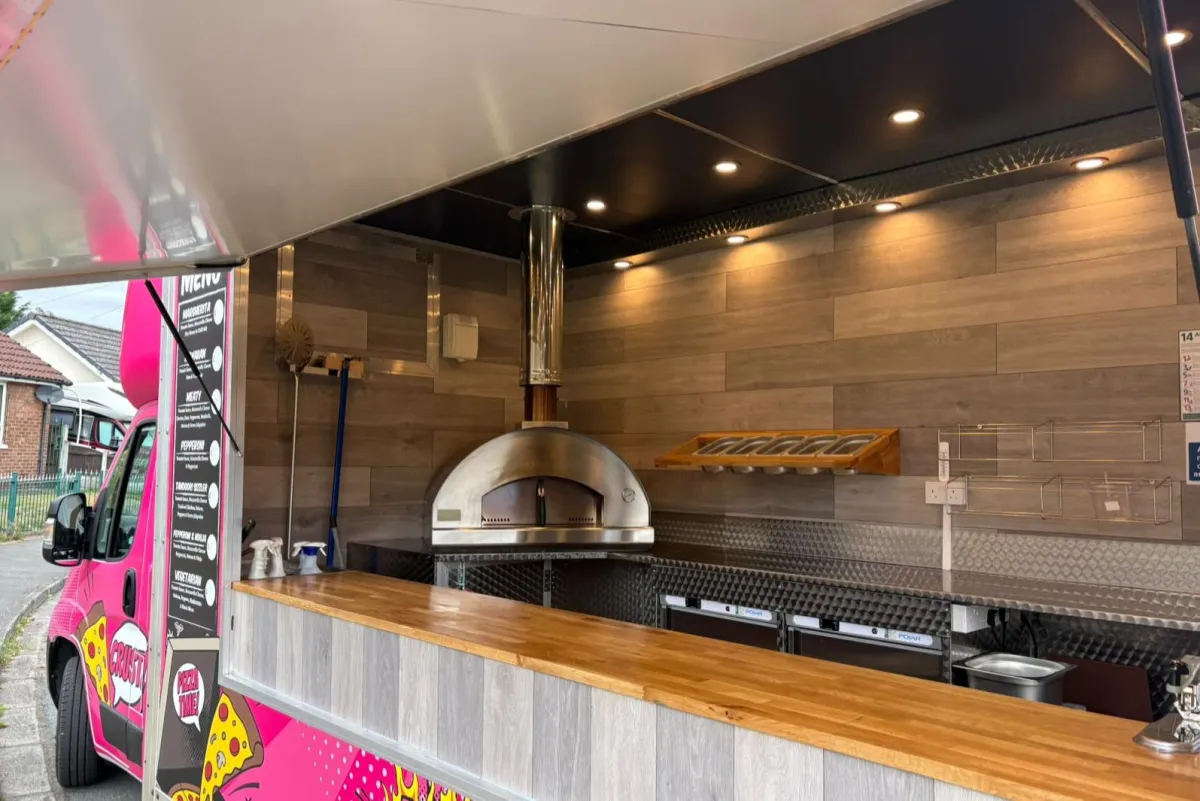 Caterer in Manchester serving wood fired pizza to wedding guests