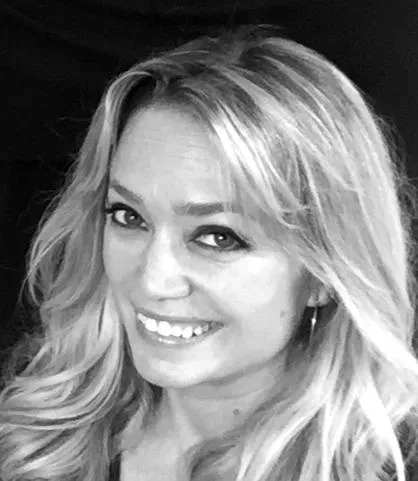 Portrait of Tina, safety educator, smiling warmly in a light-filled room