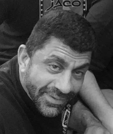 Portrait of Tina, safety educator, smiling warmly in a light-filled room