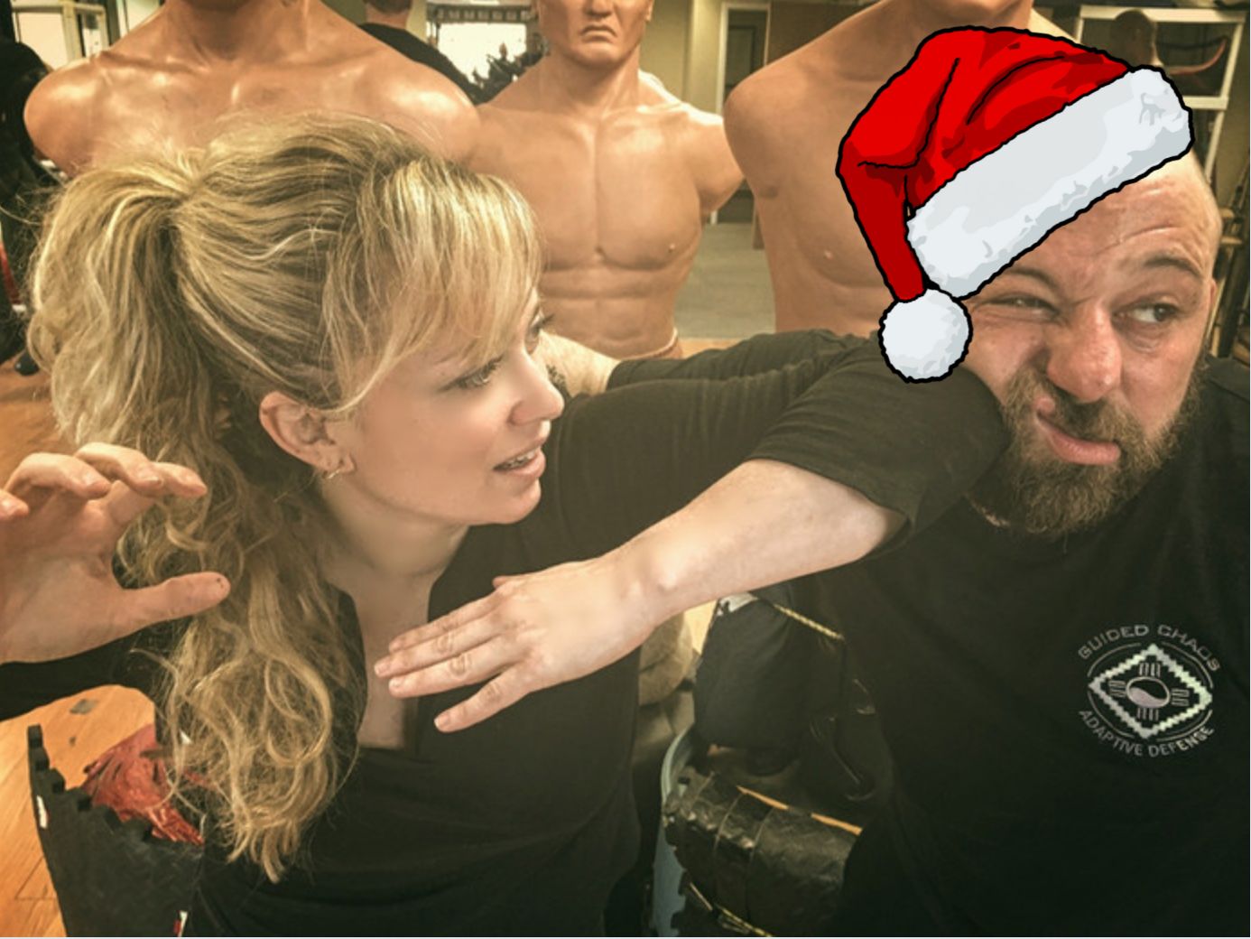 A diverse group of adults in a sunlit event space with peach and rose accents, smiling and engaging in conversation.