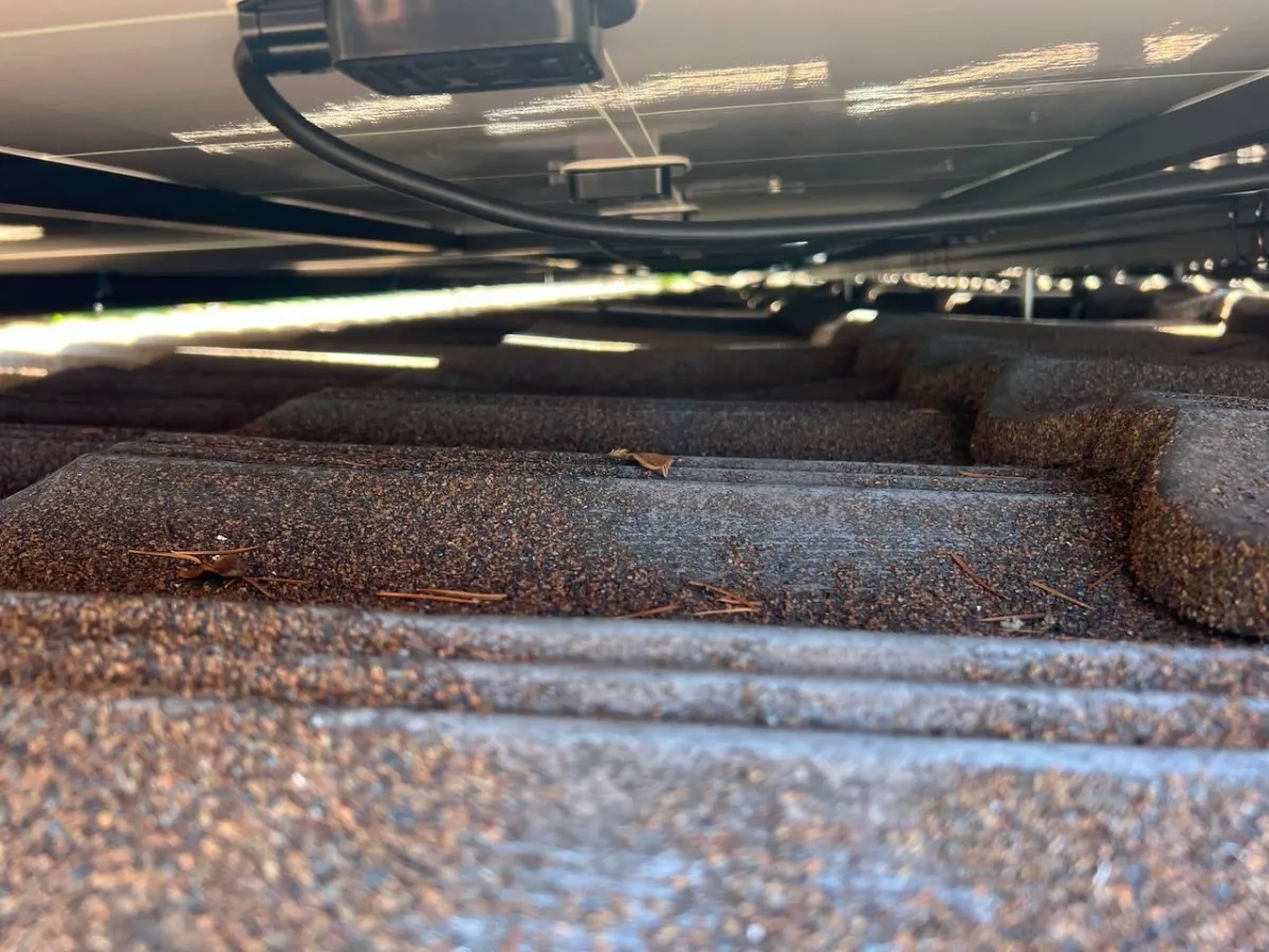 Picture showing underneath solar array on a metal tile roof
