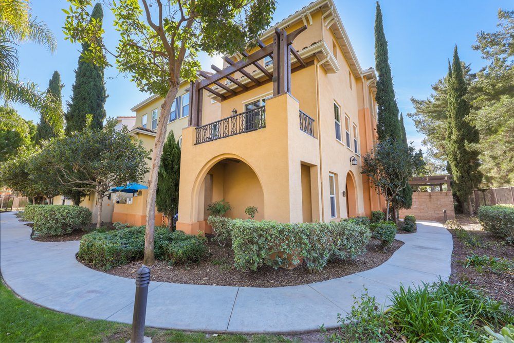 a kitchen with a stove top oven next to a window