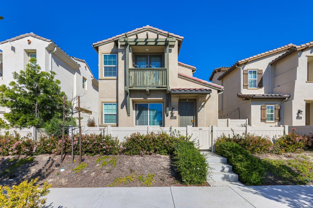 a modern house with a pool in the middle of the yard