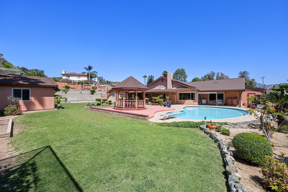 a kitchen with a stove top oven next to a window