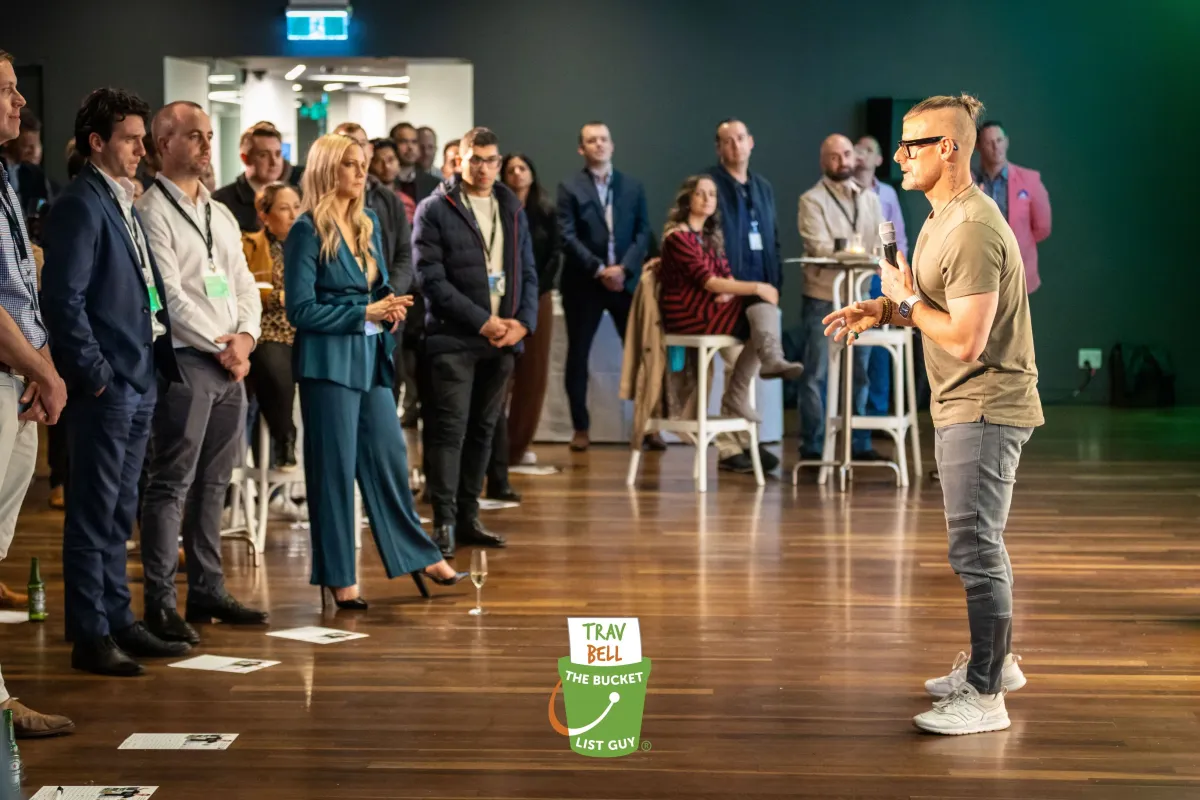 Trav Bell speaking to a business audience at an event