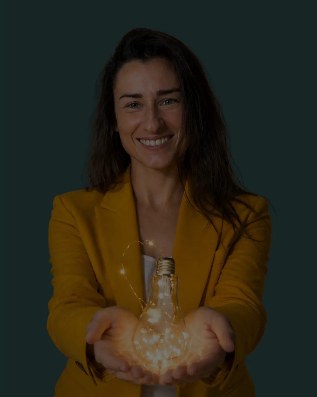 man holding incandescent bulb