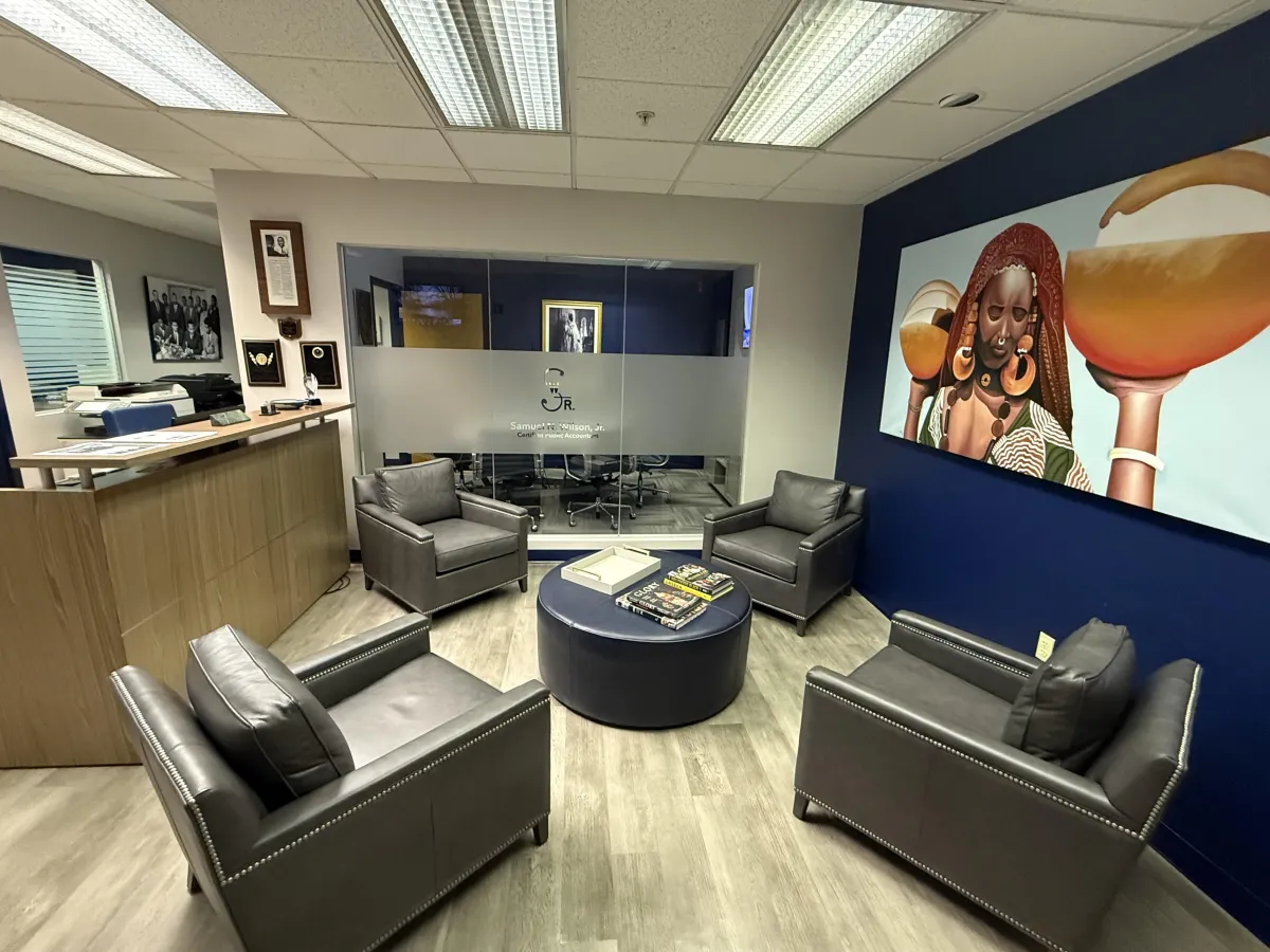 Bills, calculator, and a laptop: financial tasks underway.