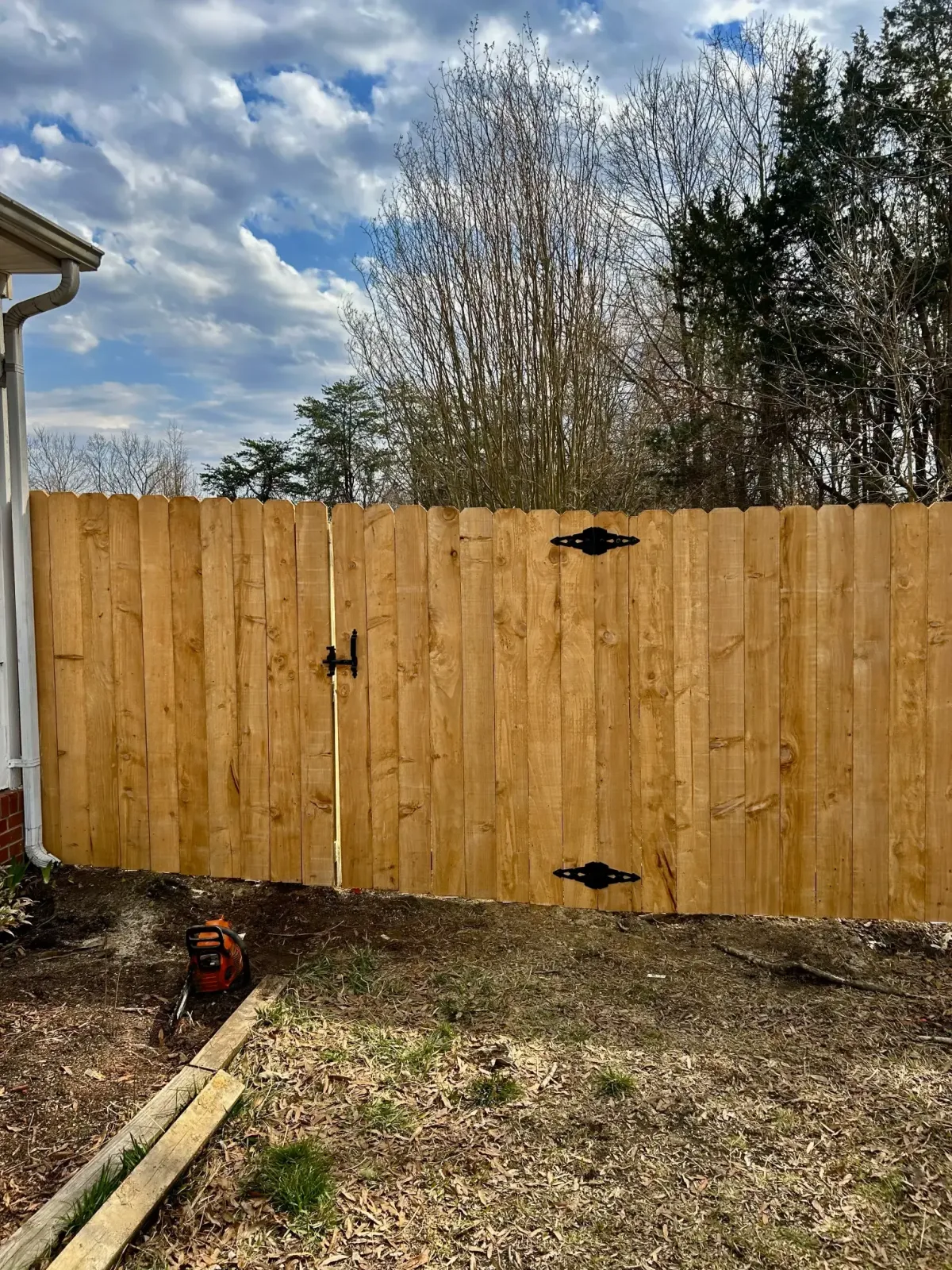 a fencing company installs a gate