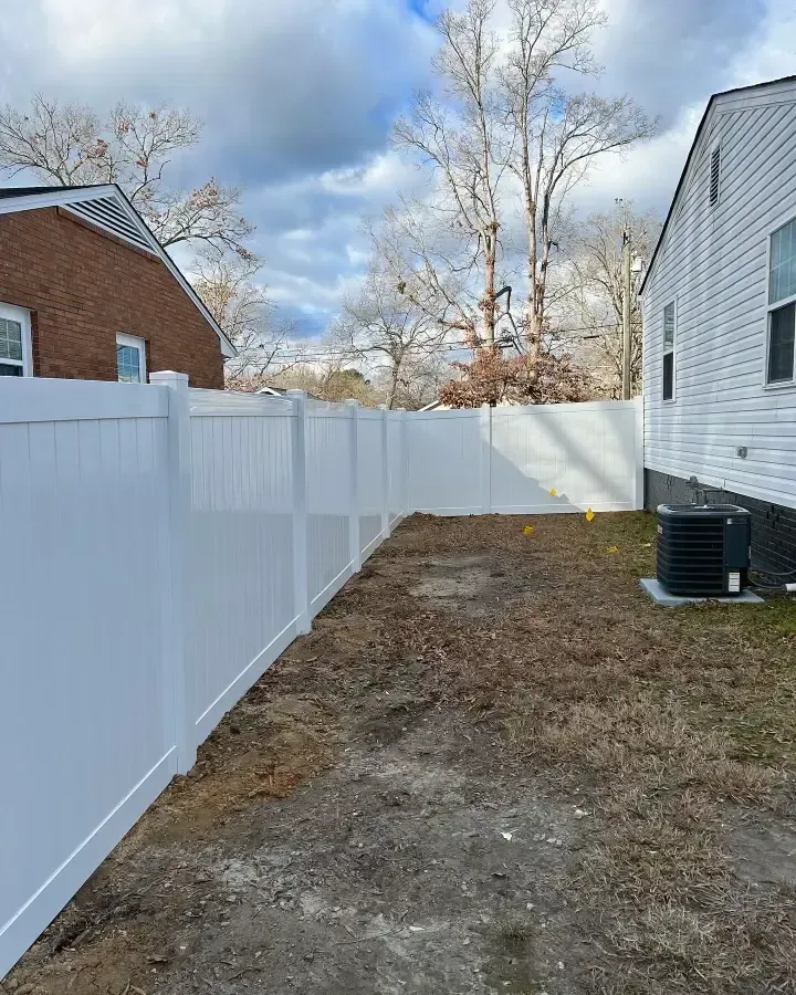 a proud fence builder putting up a fence