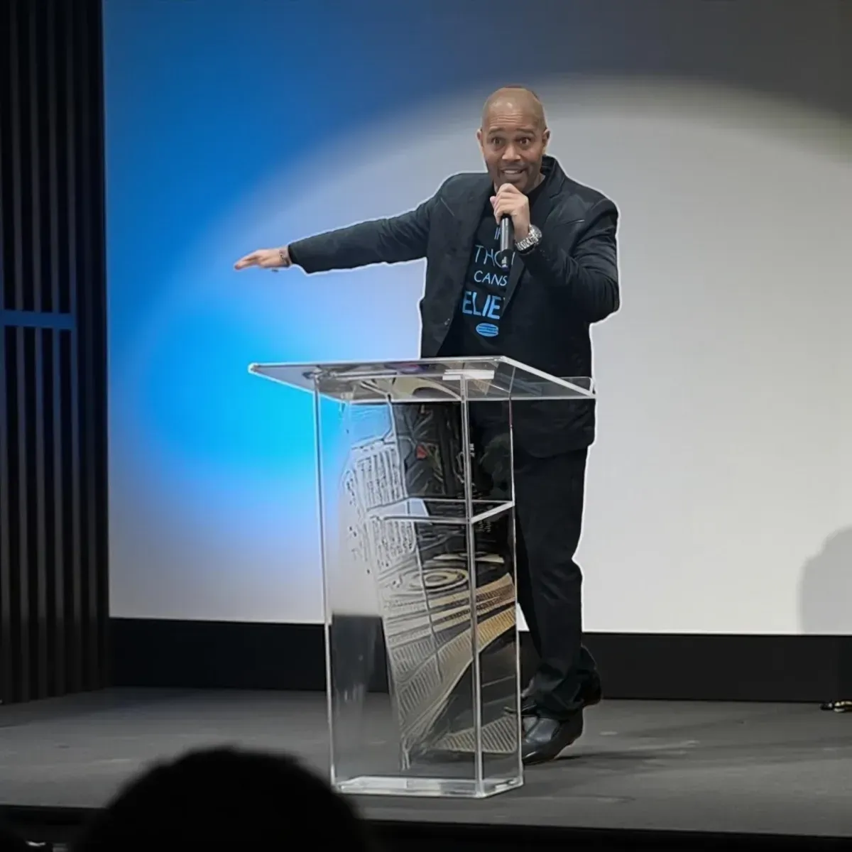 Dennis West speaking at a church event