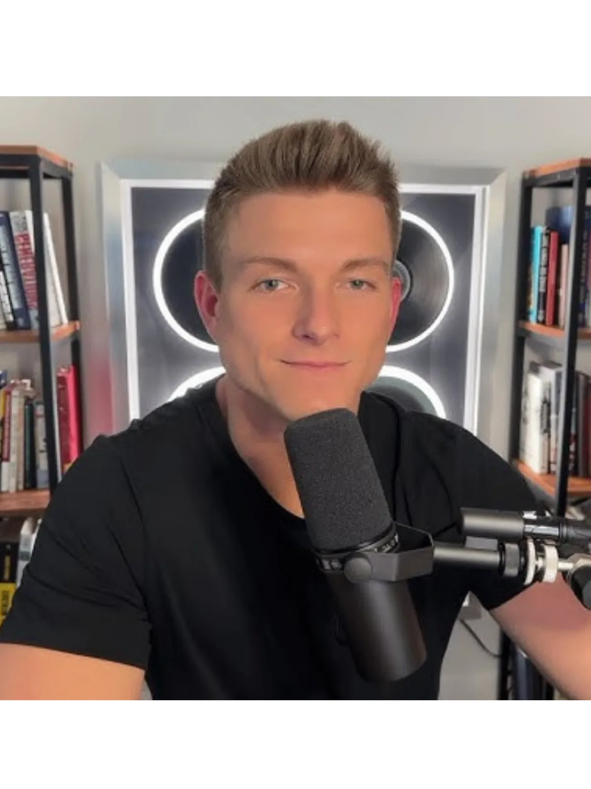 Ryan Clogg behind podcast mic