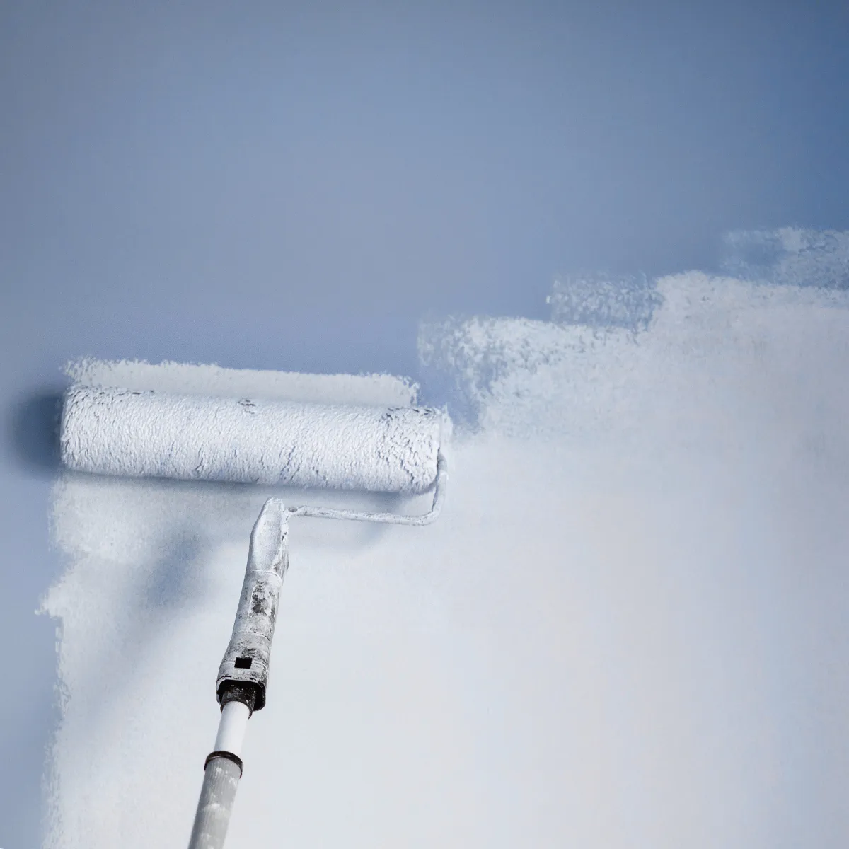 Bars Property Services team repainting an interior wall with a fresh coat of white paint for a smooth, clean finish.