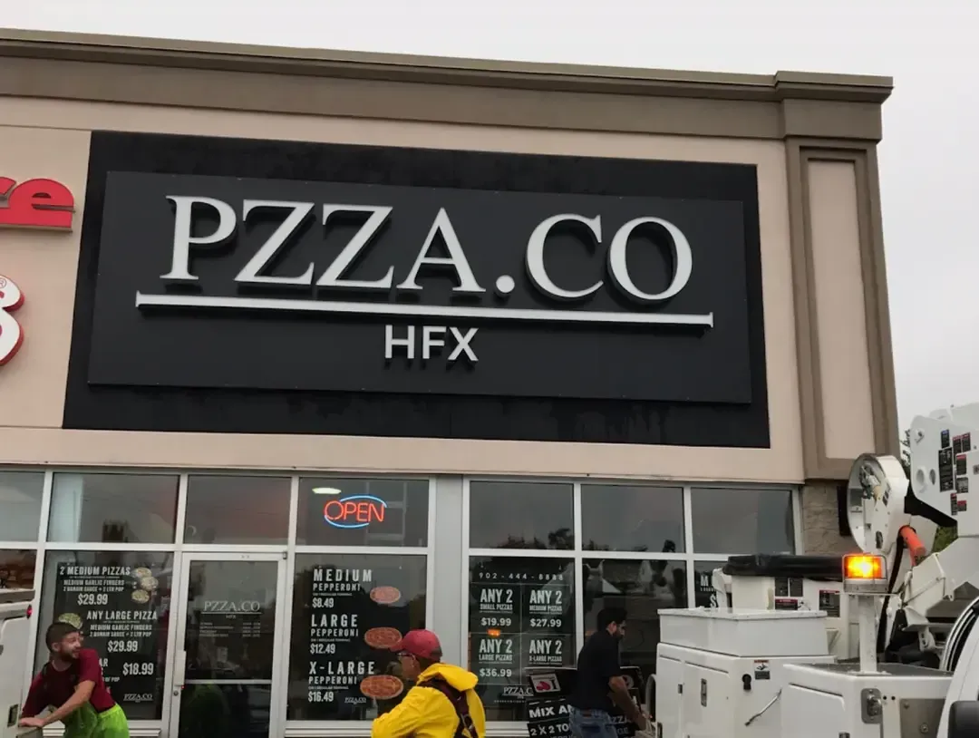 Bars Property Services crew performing exterior cleaning at the PZZA.CO HFX restaurant storefront in Halifax.