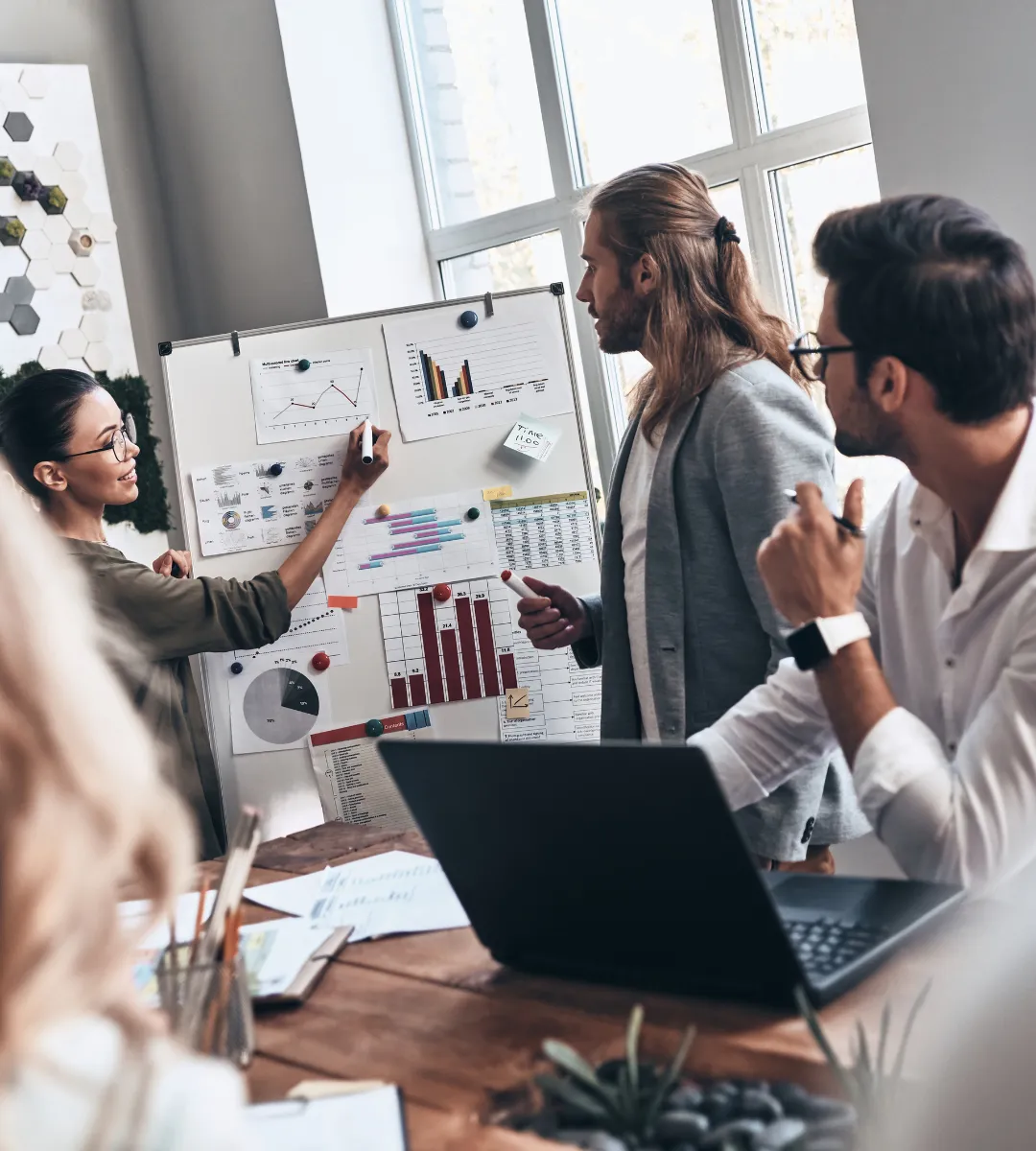 a laptop computer sitting on top of a wooden desk