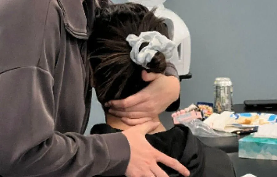 Instructor teaching Mulligan Concept shoulder mobilization technique.