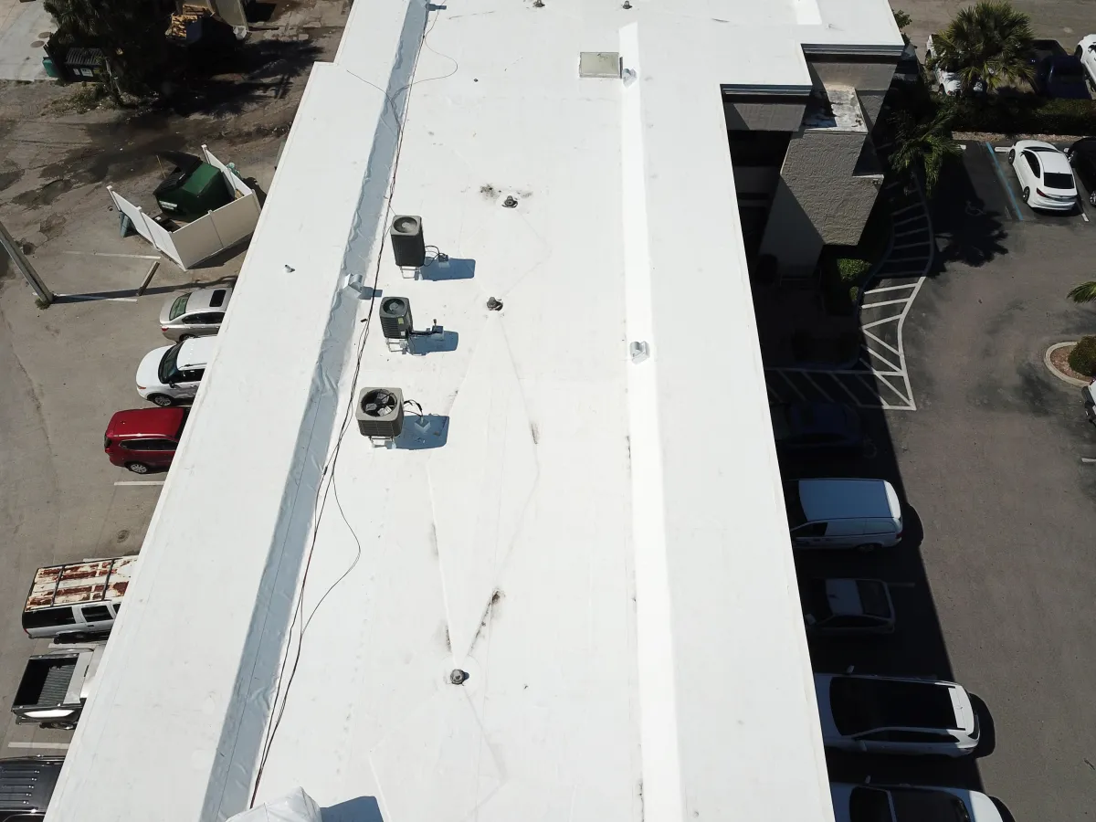 A roof with a birdhouse on top of it