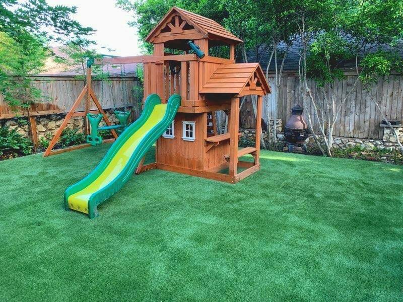 Artificial playground turf installation in Memphis TN backyard