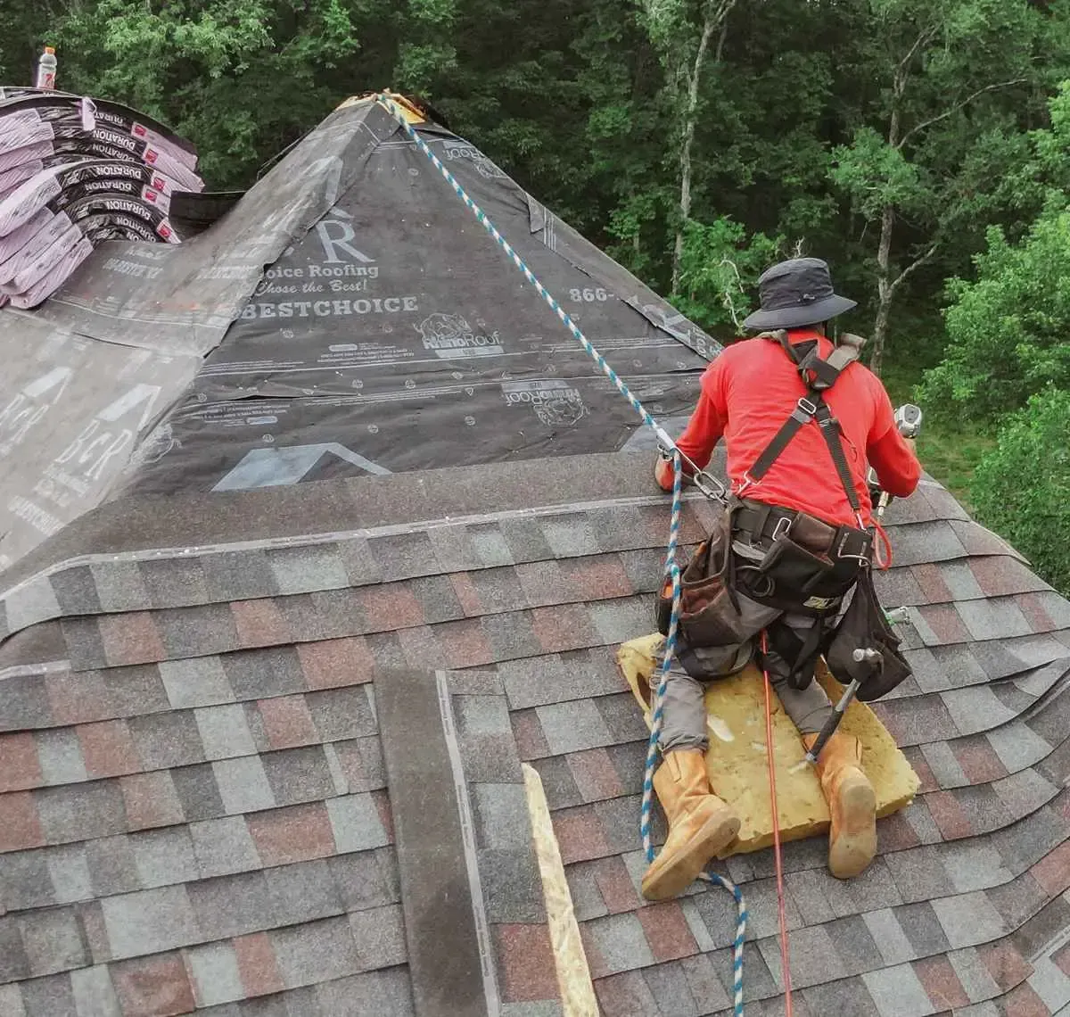 A man on a roof working on a roof