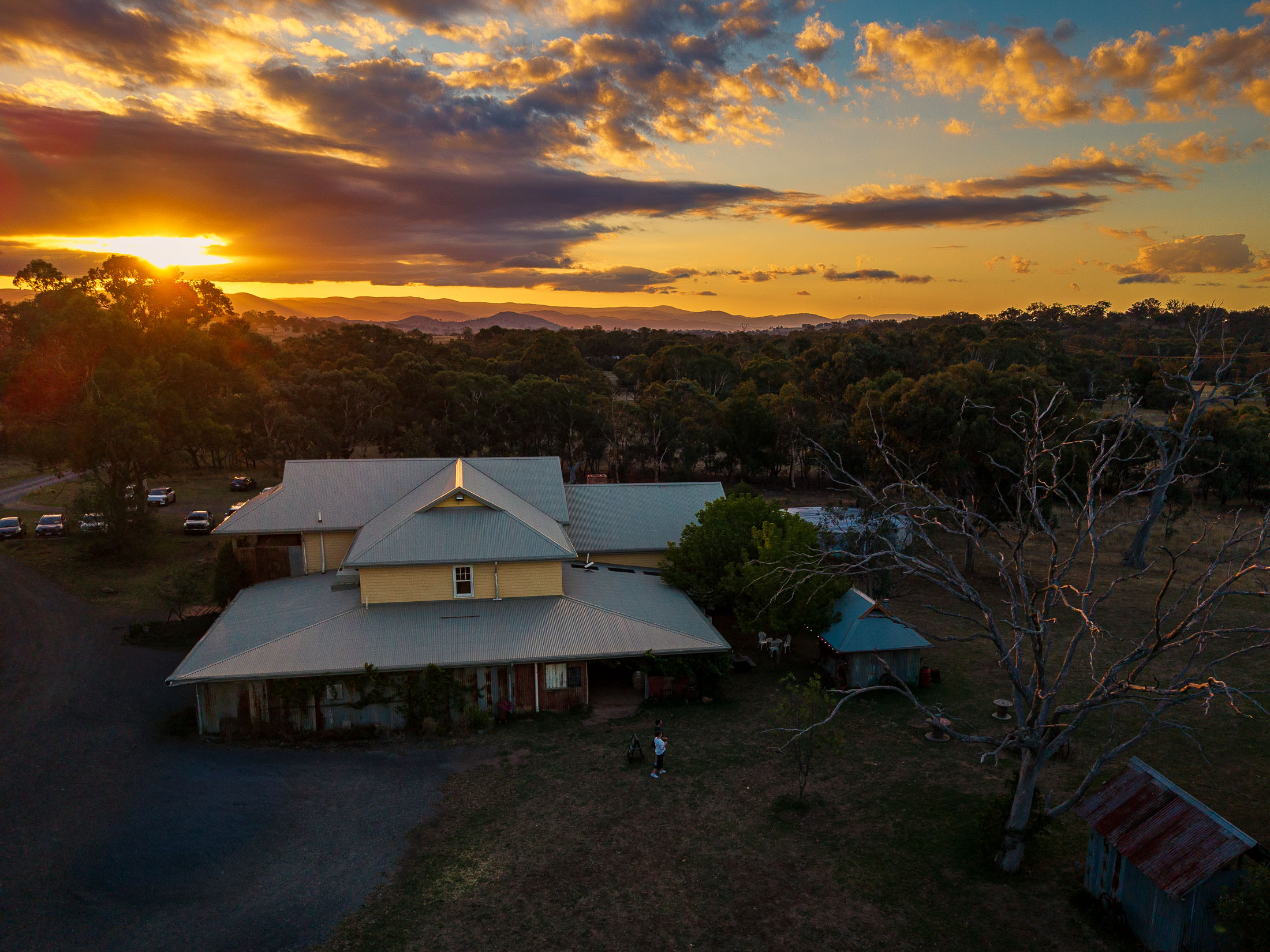 Warm evening at Gold Creek Station with guests and open landscape