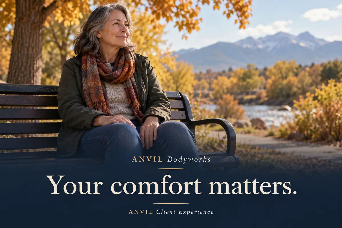 A woman resting on a park bench in autumn beside the message “Your comfort matters” from ANVIL Bodyworks.