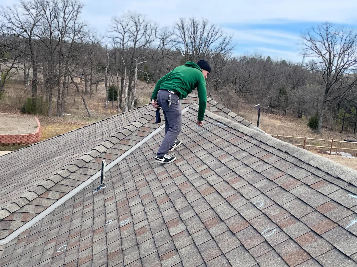 roof inspector assessing Tulsa residential roof condition