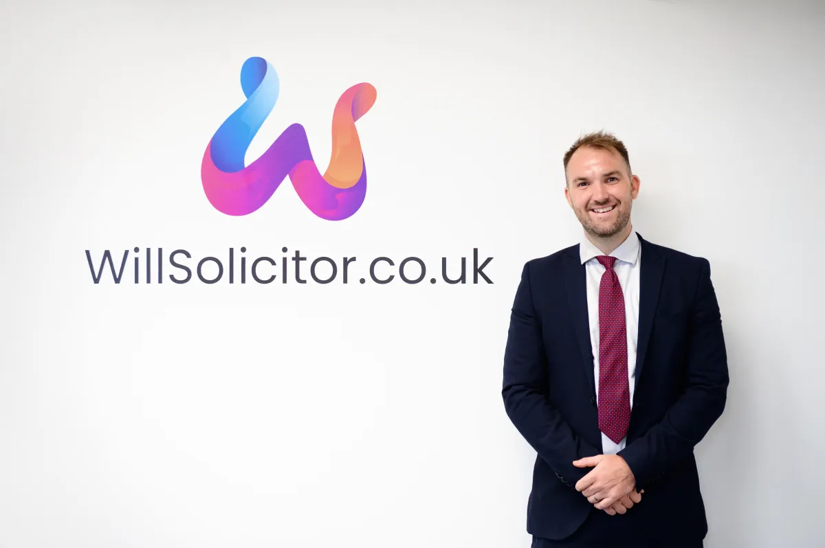 A building with green shutters on the front of it