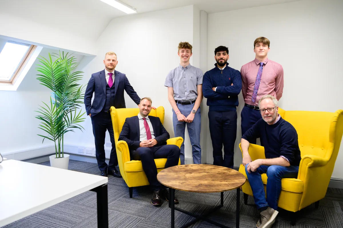 close-up photo of books in brown wooden shelf