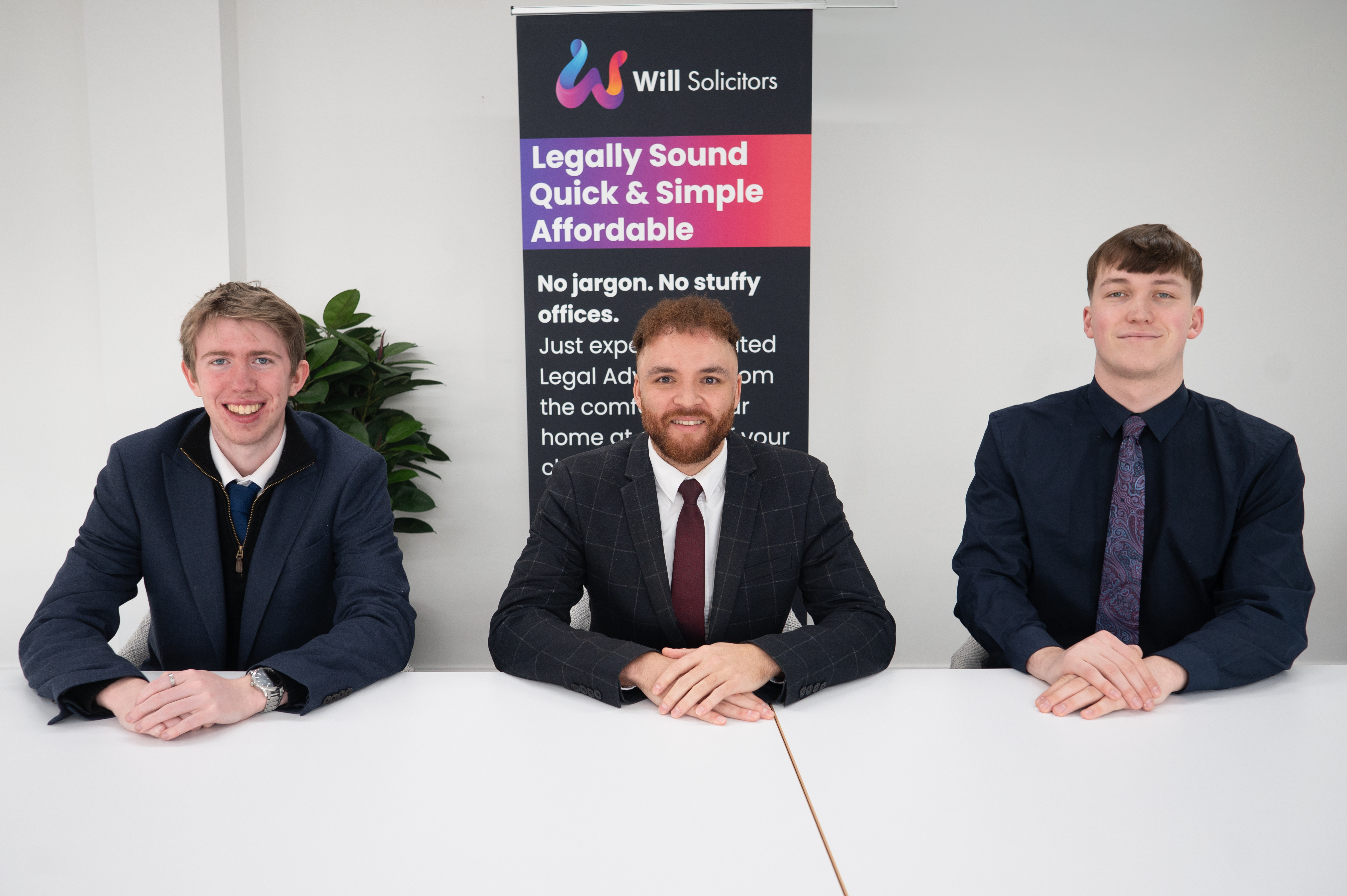 The full WillSolicitor.co.uk team seated around a wooden table