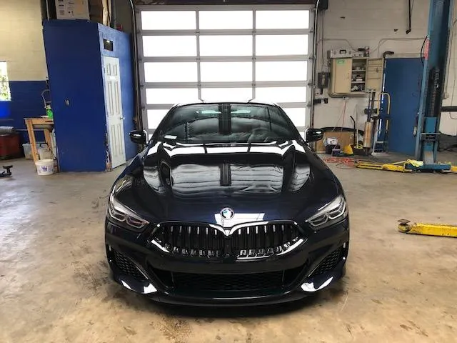 woman placing sticky notes on wall