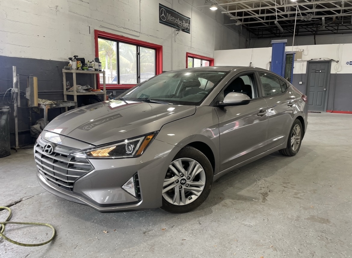 woman placing sticky notes on wall