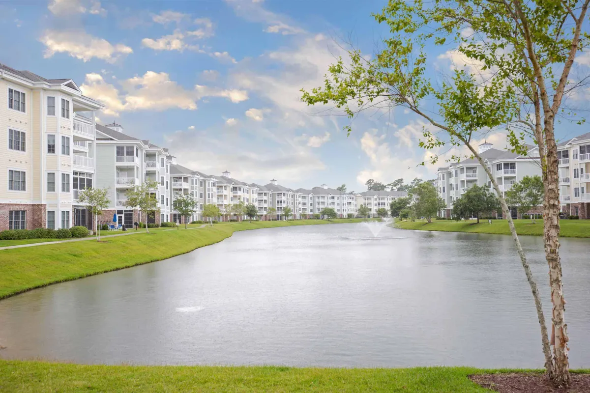 view of condos with lake in between