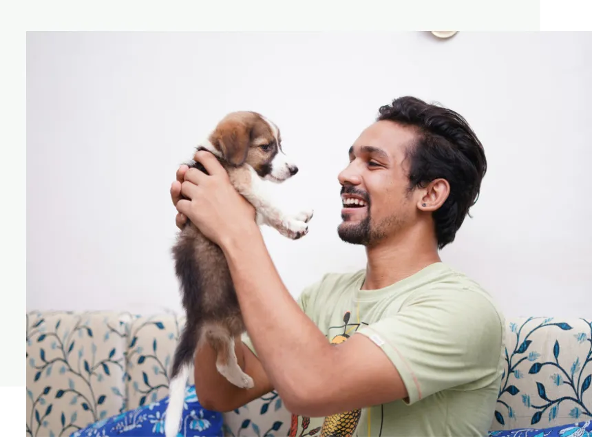 Man Holding a Puppy