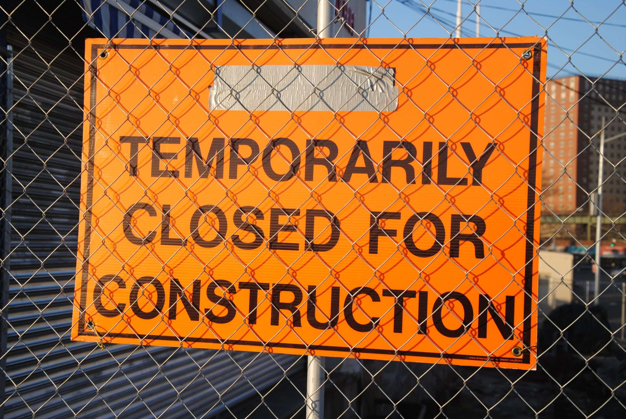 Temporarily closed for construction sign graphic, suitable for business renovation announcements, construction site signage, or building maintenance updates.