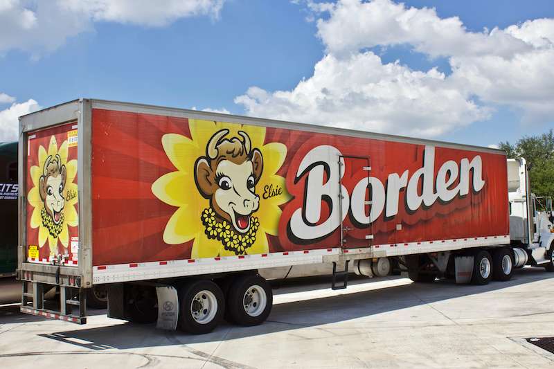 SignSmiths trailer wrap graphic with 17.5 Clic performance highlight