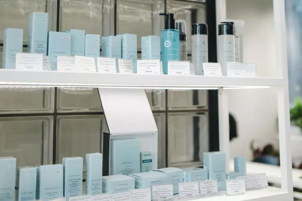 Retail product display shelves showcasing skincare products in a store, used for custom product displays, retail merchandising, and attracting customer attention in retail environments.