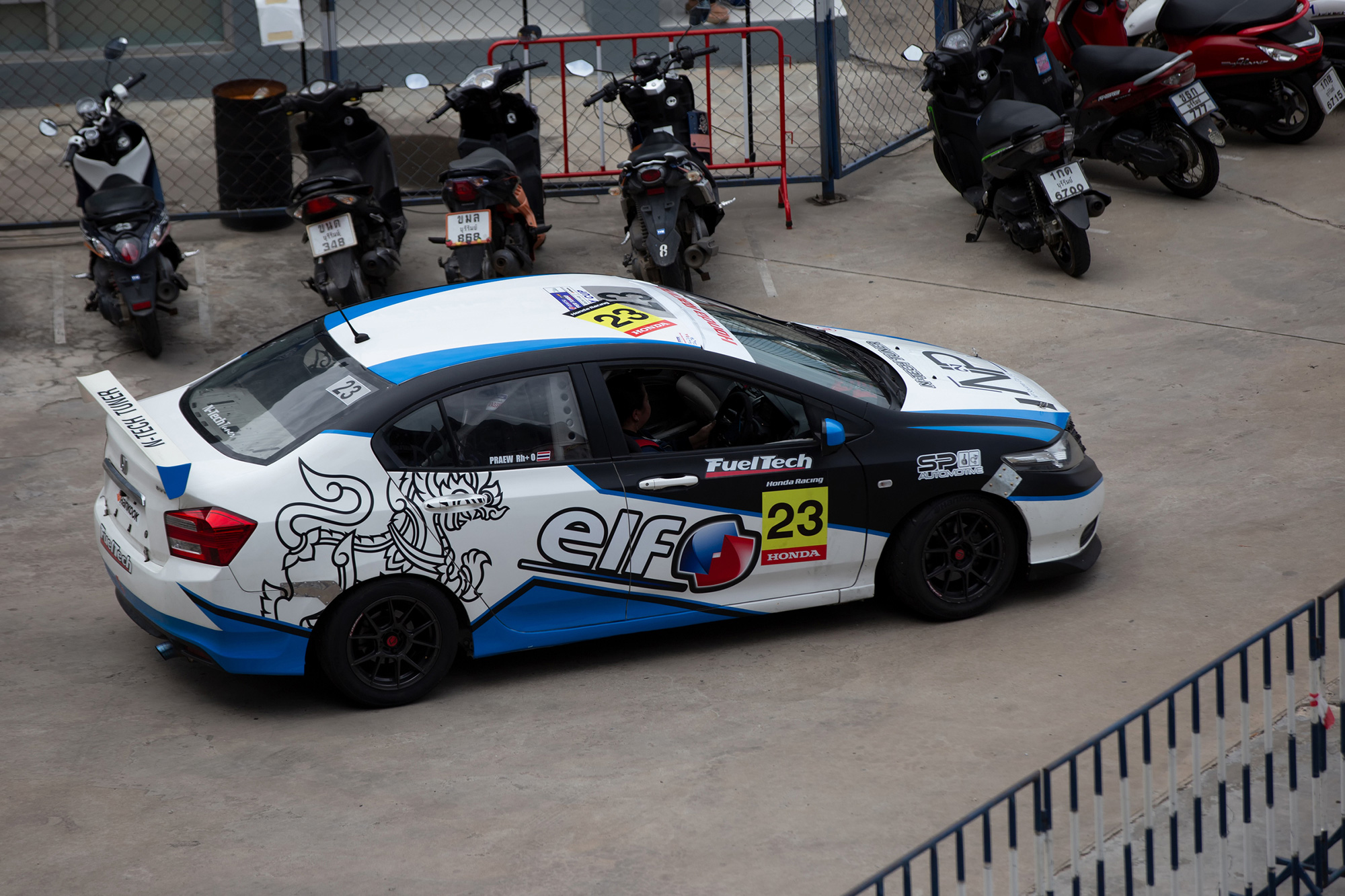 Full vehicle graphics wrap with custom branding installed on a car