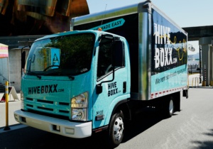 Commercial truck with custom vinyl wrap advertising a business