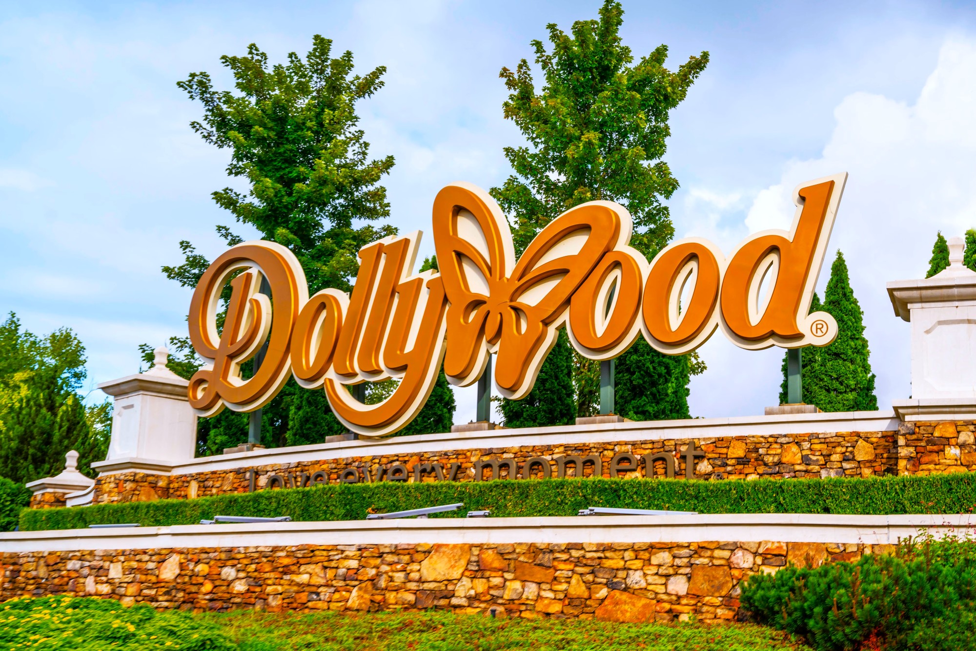 Large resort monument entrance sign with decorative lettering