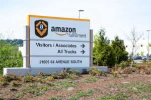 Amazon warehouse entrance monument sign outside industrial facility