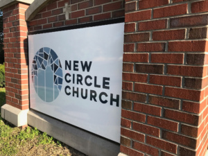 Modern church monument sign displaying church name at entrance