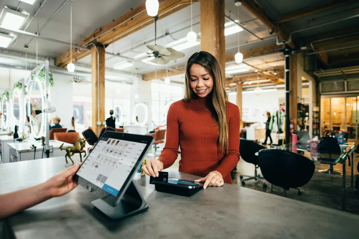 A retail shop serving a customer at checkout