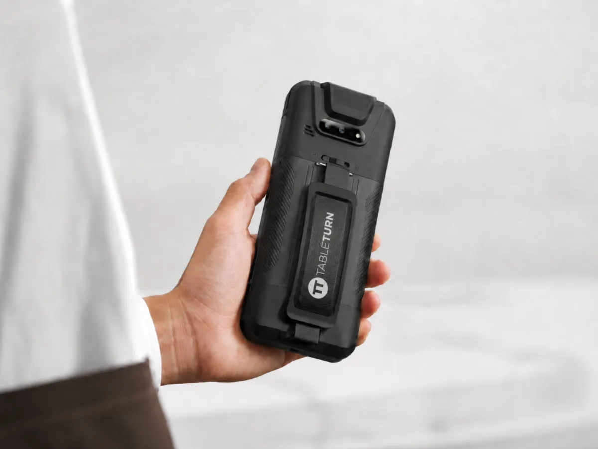 TableTurn handheld POS device being used for tableside ordering and payments