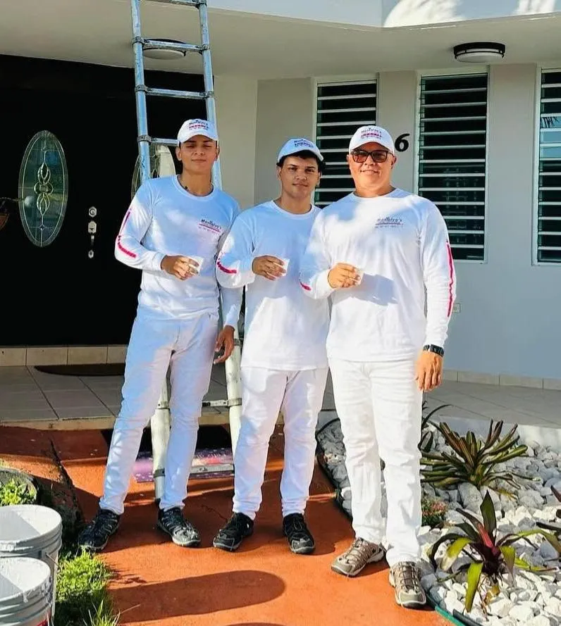 Omar Montalvo on site inspecting a premium exterior coating in Puerto Rico