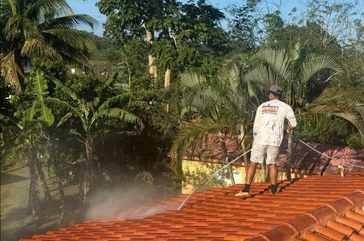 Contractor power washing an exterior surface in Puerto Rico