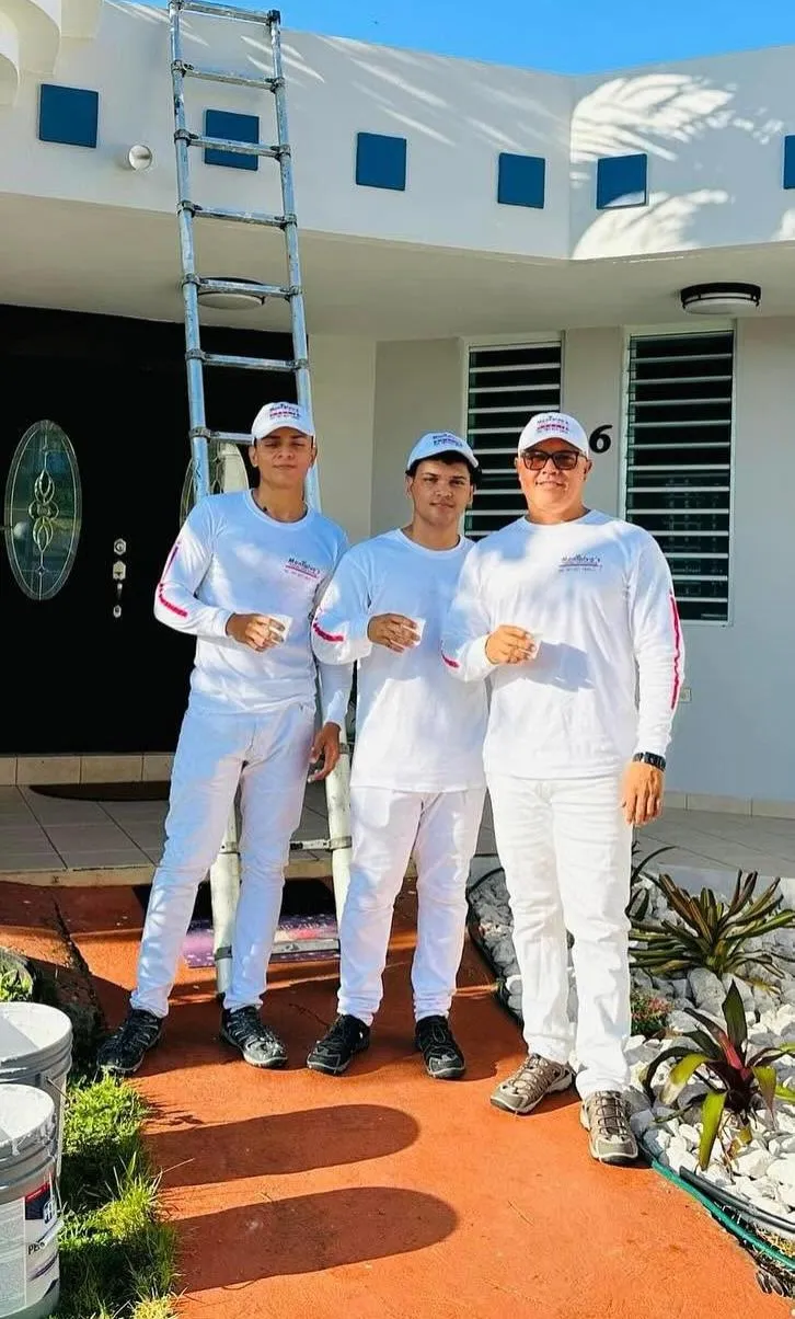 Omar Montalvo on site inspecting a premium exterior coating in Puerto Rico