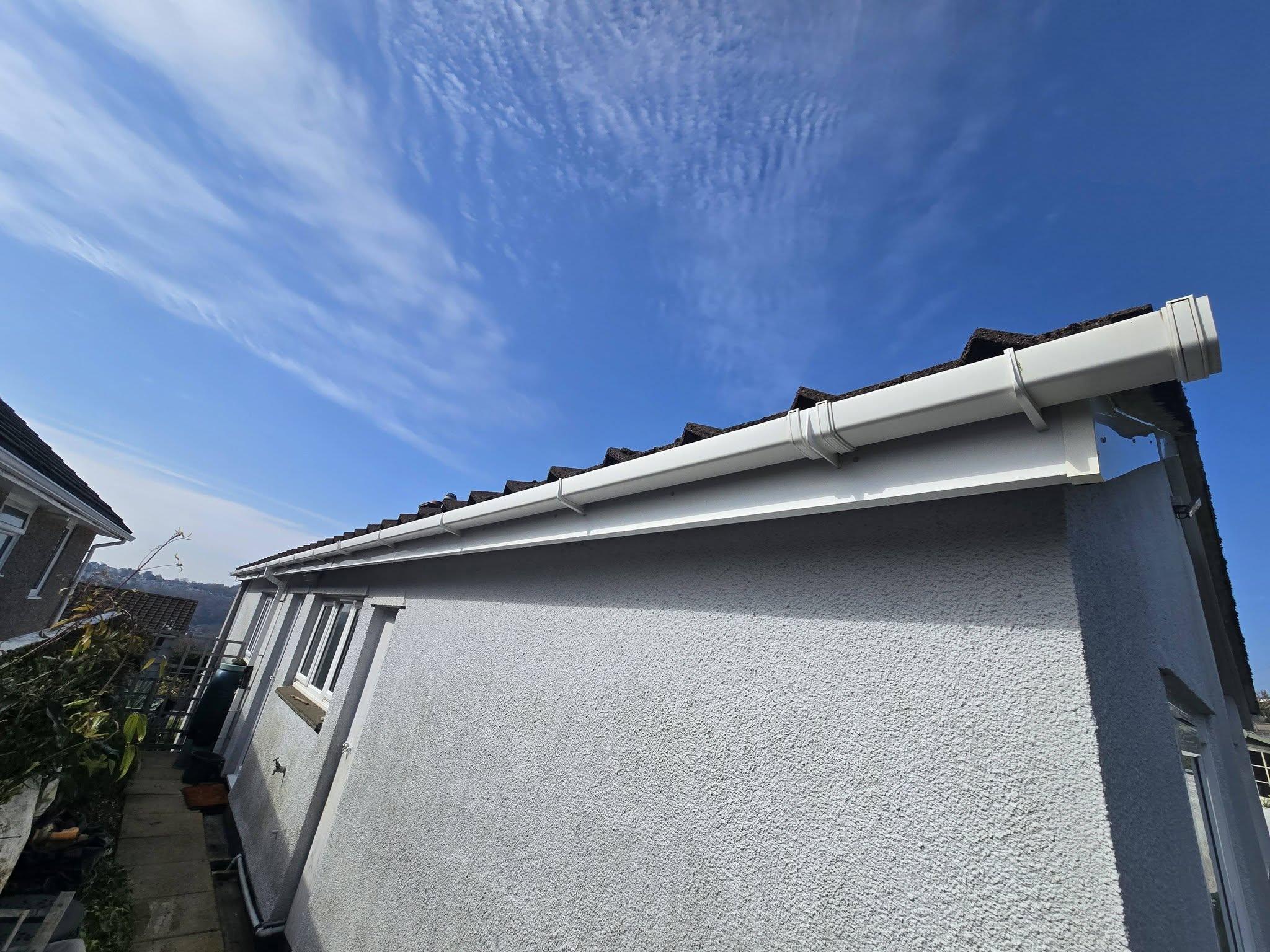Clean white fascias, soffits and gutters on a home in Plymouth